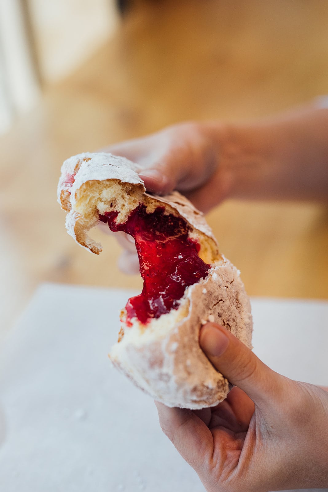 Person holding a donut from Bernie Beigne